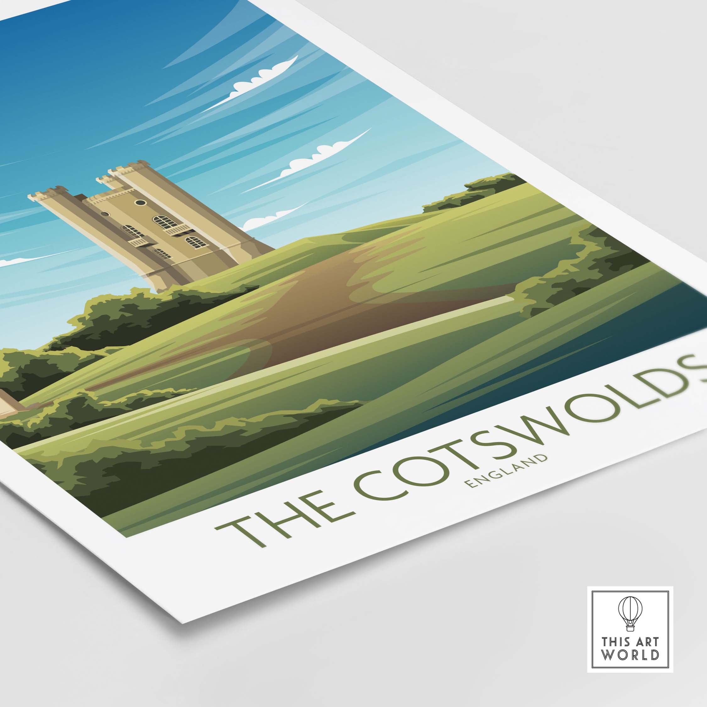The Cotswolds print featuring a vintage-style illustration of a castle and green hills in England.