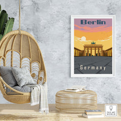 Stylish Berlin poster print hanging in a modern interior with a rattan chair and decorative elements.