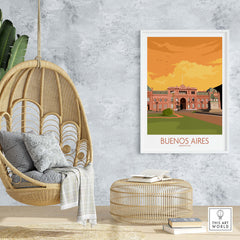 Buenos Aires vintage travel poster in a stylish home setting with a hanging chair and decorative elements.