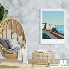 Stylish Costa Brava Calella Spain poster displayed in a modern living space with hanging chair and natural decor.