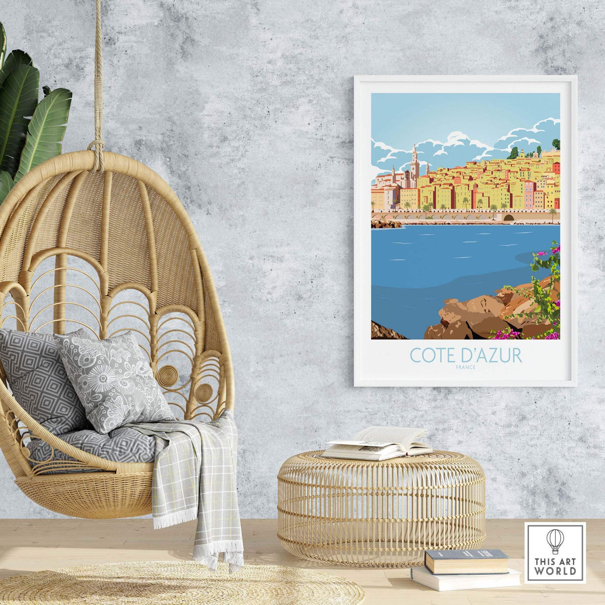 Cote d'Azur print poster displayed in a stylish room with hanging chair and decorative accents.