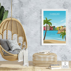 Curacao Poster Print featuring colorful buildings, palm trees, and a serene beach in a stylish indoor setting.