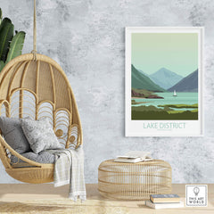 Lake District poster print displayed in a stylish interior with a hanging chair and natural decor.