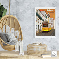 Lisbon vintage travel poster in a modern living room with wicker chair and decor accents, showcasing Lisbon's iconic tram.