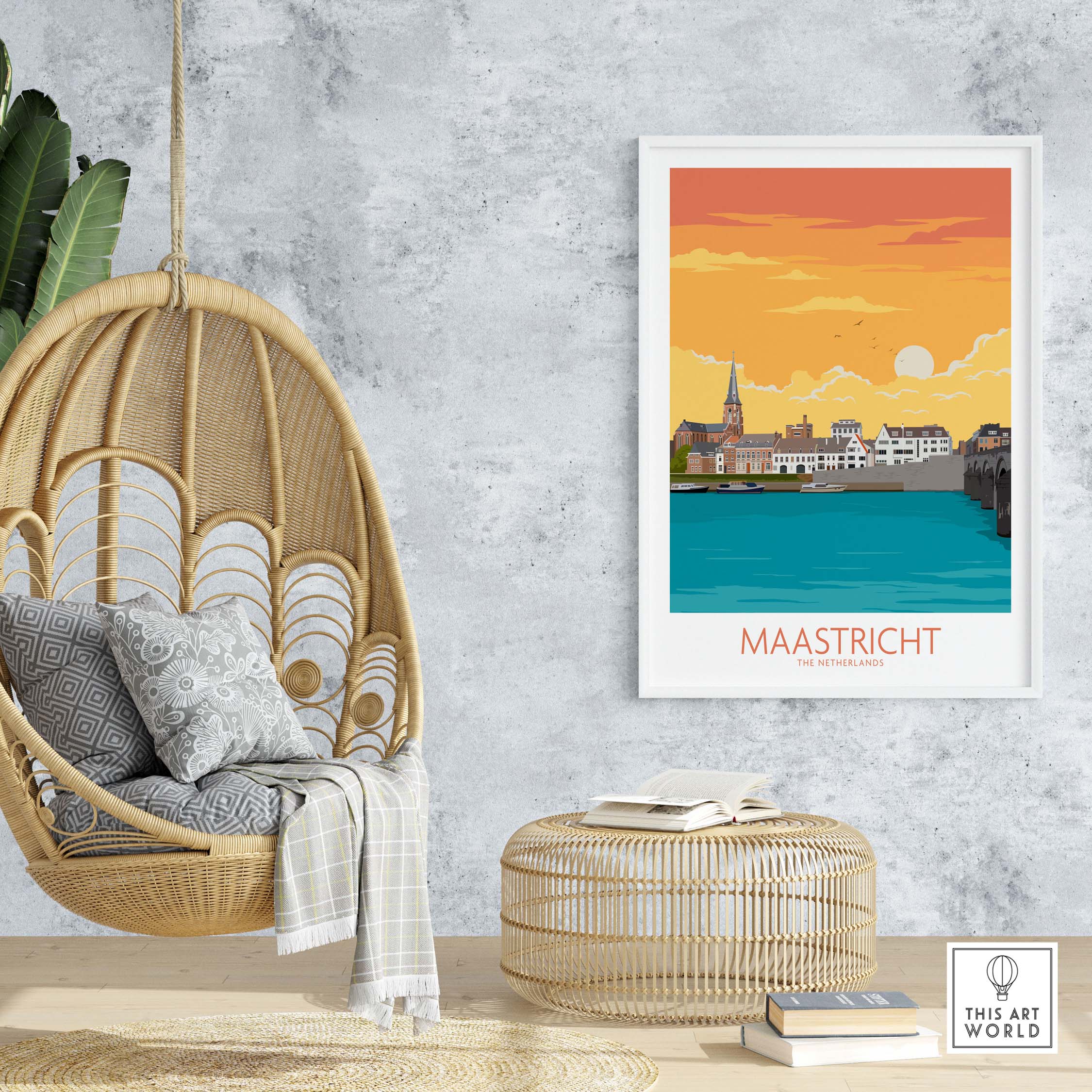 Stylish Maastricht travel poster artwork displayed on a wall above a hanging chair and a round coffee table.