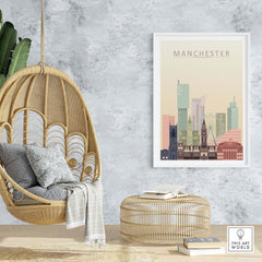 Manchester City skyline print on wall in a cozy living space with hanging chair and woven decor.