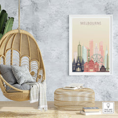 Melbourne skyline print showcasing iconic architecture in warm pastel tones, hanging in a cozy interior setting.