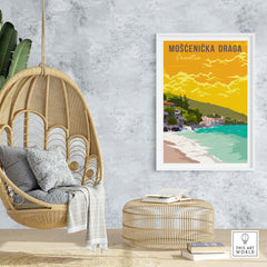 Mošćenička Draga Croatia poster print displayed in a modern interior setting with a hanging chair and natural decor.