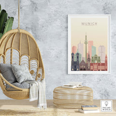 Munich skyline print in warm pastel tones displayed in a stylish hanging chair living room setting.