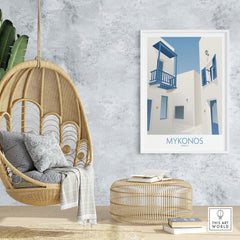 Mykonos wall art print displayed in a cozy interior with a hanging chair, bringing a touch of travel nostalgia to home decor.