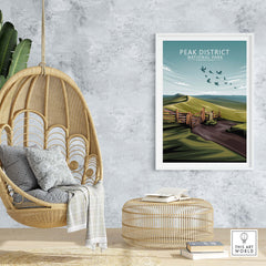 Peak District National Park poster displayed in a stylish home setting with hanging chair and decor.