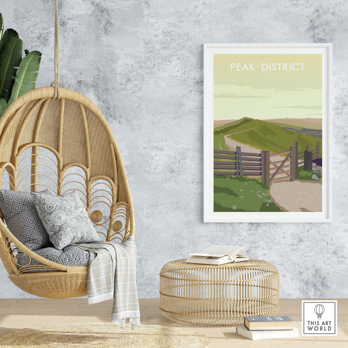 Peak District travel poster print in a stylish home setting with a hanging chair and decorative elements.