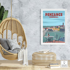 Penzance Cornwall poster print displayed in a stylish home setting with hanging chair and decor.