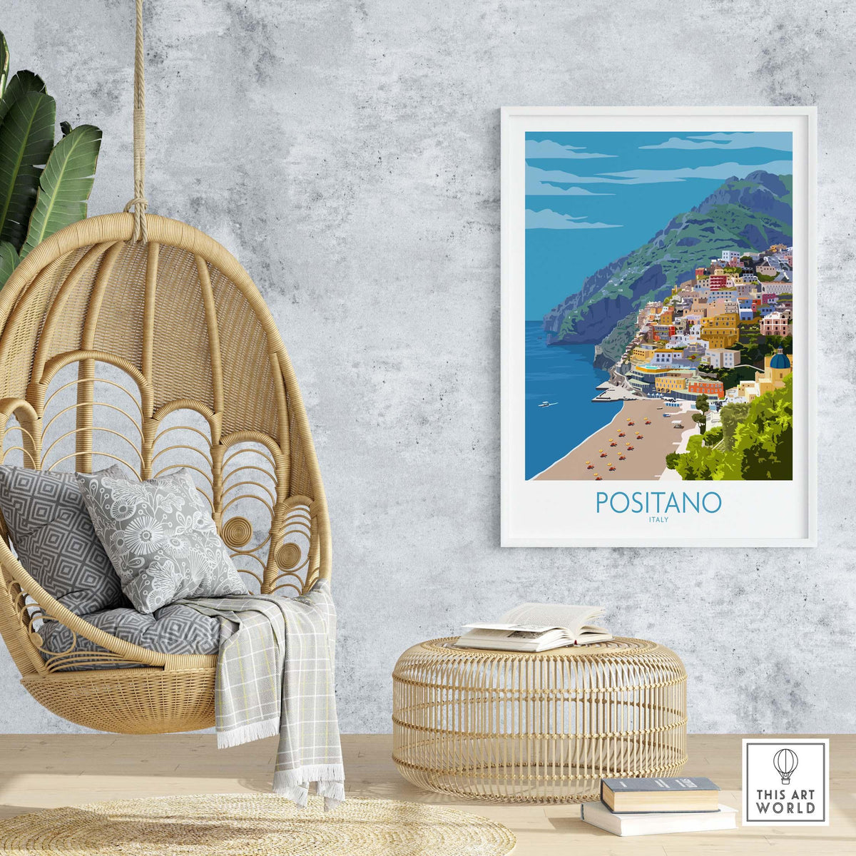 Positano Print Travel Poster framed in a stylish setting with a hanging chair and woven decor.