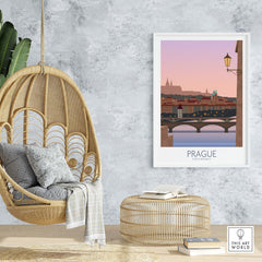 Prague Print Travel Poster displayed in a stylish room with a hanging chair and woven decor, capturing a nostalgic travel vibe.