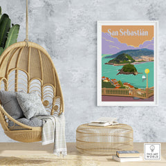 San Sebastian Spain vintage poster print displayed in a stylish interior with hanging chair and decor.