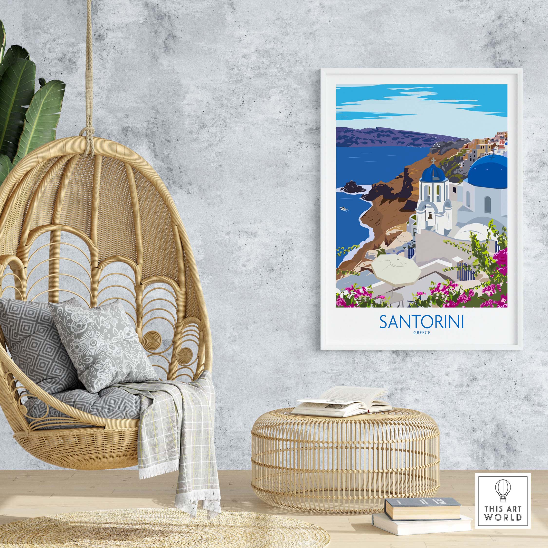 Santorini print travel poster displayed in a stylish interior with hanging chair and decorative elements.