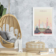 Venice wall art print showcasing city skyline in pastel tones, displayed in a cozy interior with a hanging chair.