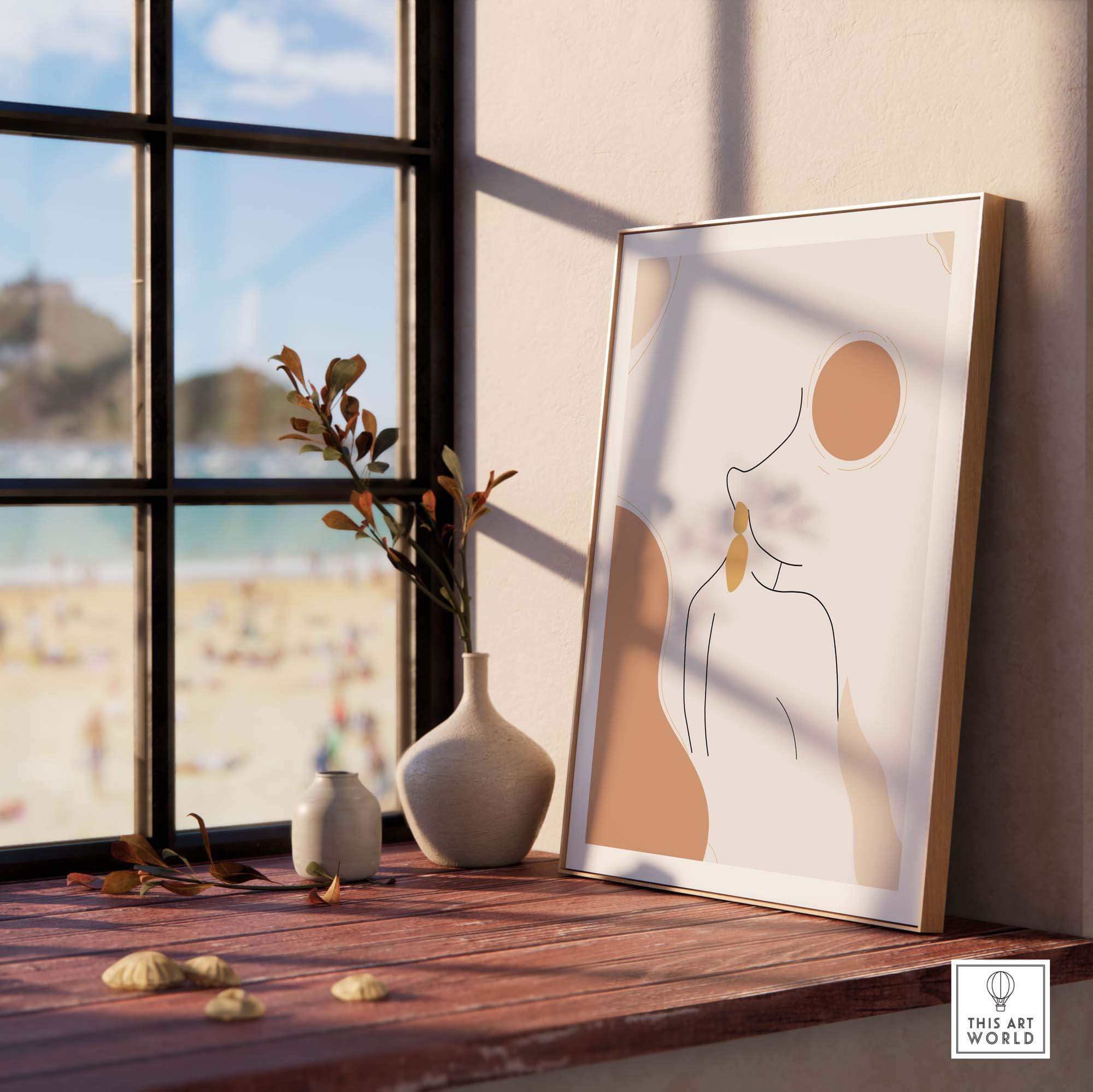 Abstract female outline print displayed on a windowsill, enhancing a stylish interior with modern wall art.