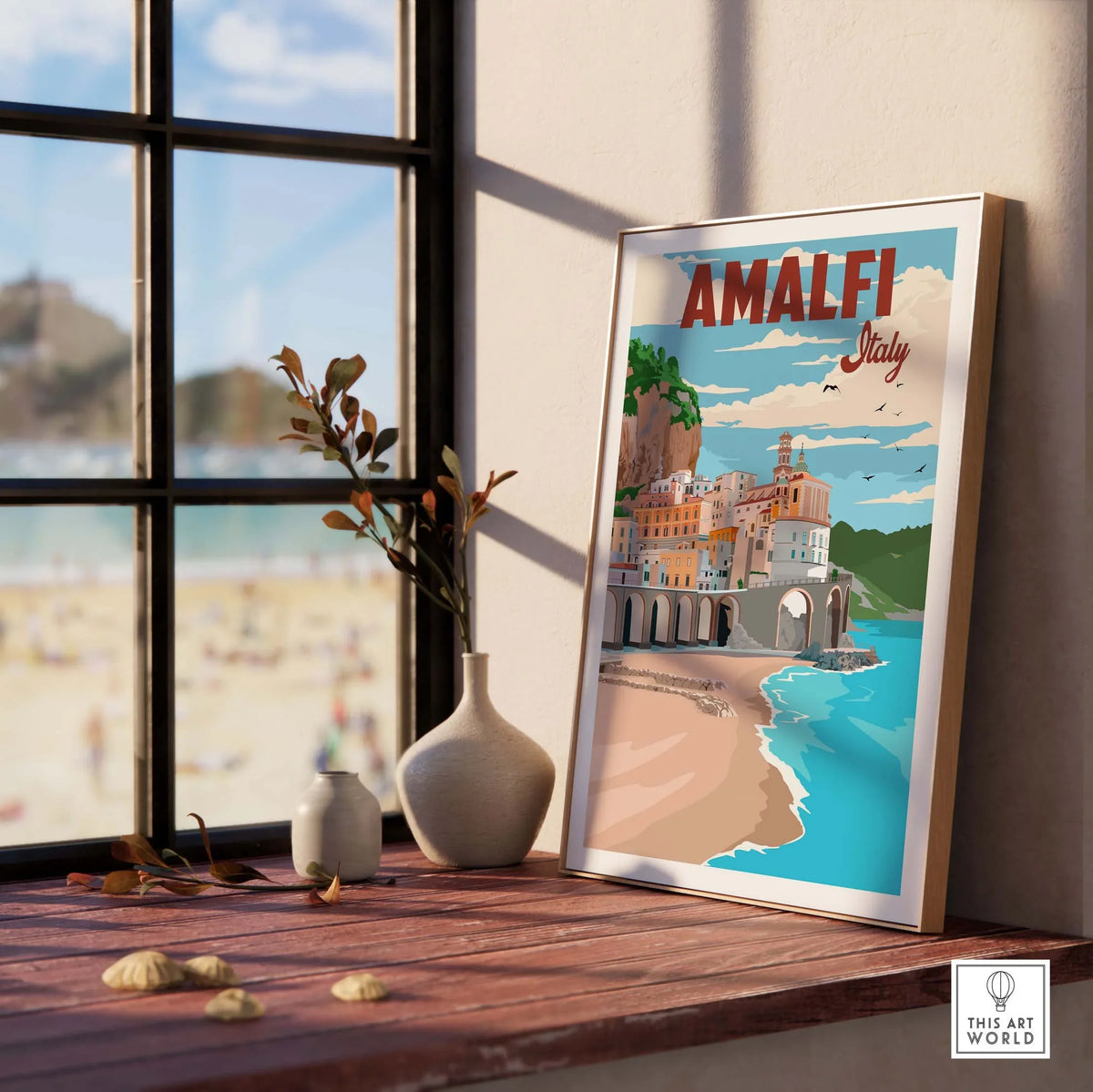 Amalfi Coast vintage poster art print displayed in a sunlit room with beach view, showcasing vibrant travel design.