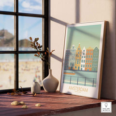Framed Amsterdam print featuring vintage-inspired buildings near water, showcasing modern wall art for travel lovers.