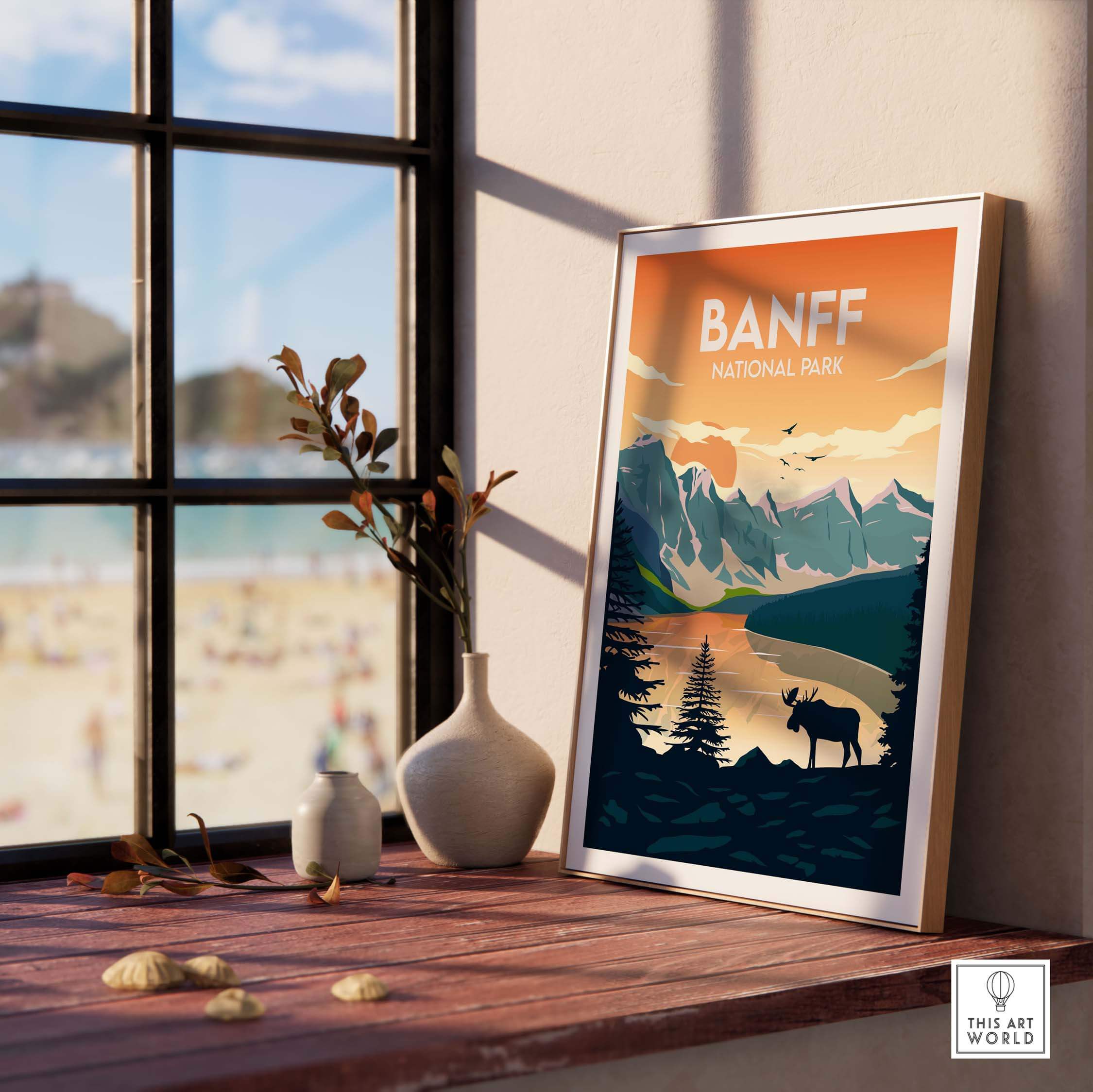 Banff National Park poster framed on a table with decorative elements, showcasing minimalist travel art.