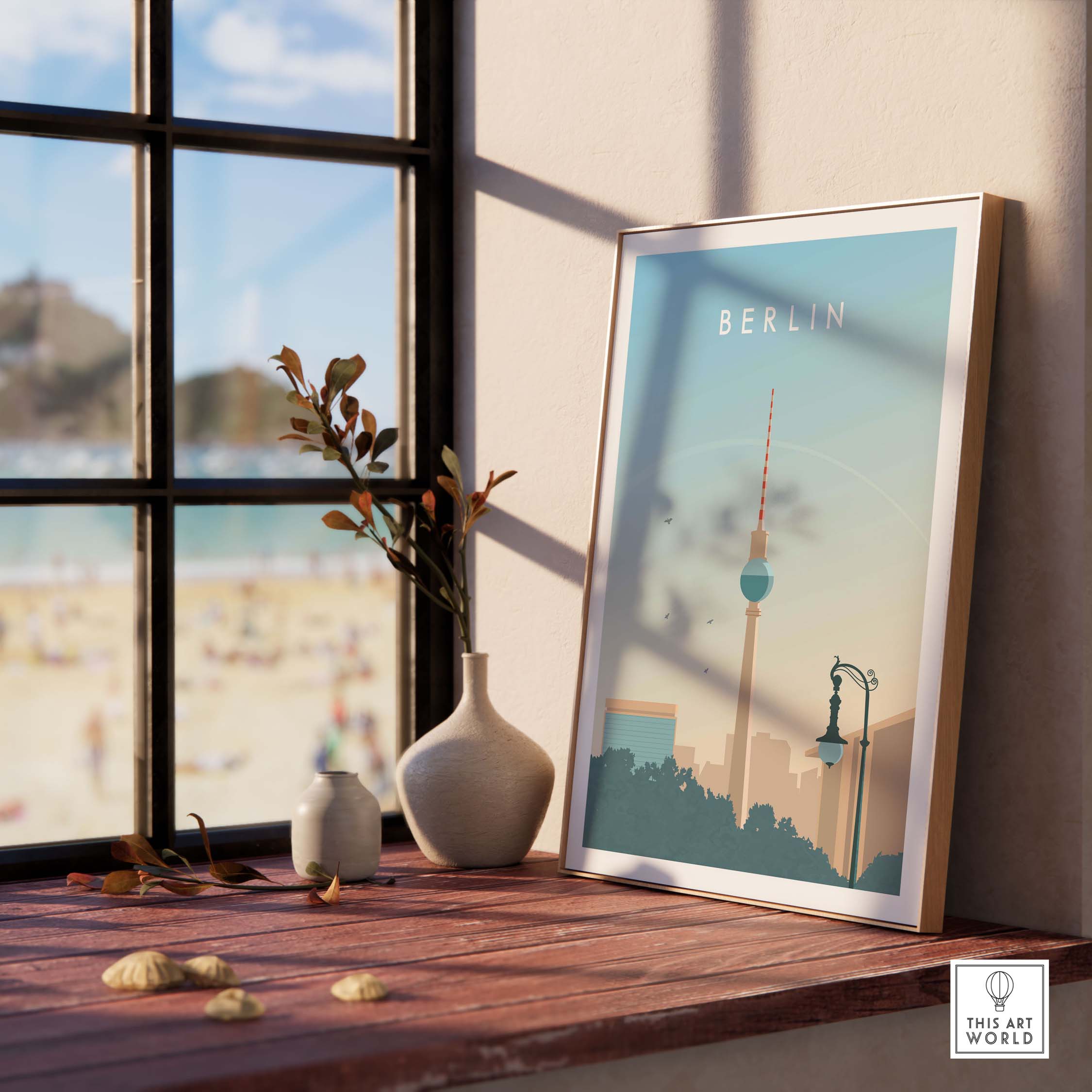 Berlin Print Wall Art Poster displayed on a wooden table with a view of the beach, featuring vintage-inspired design.