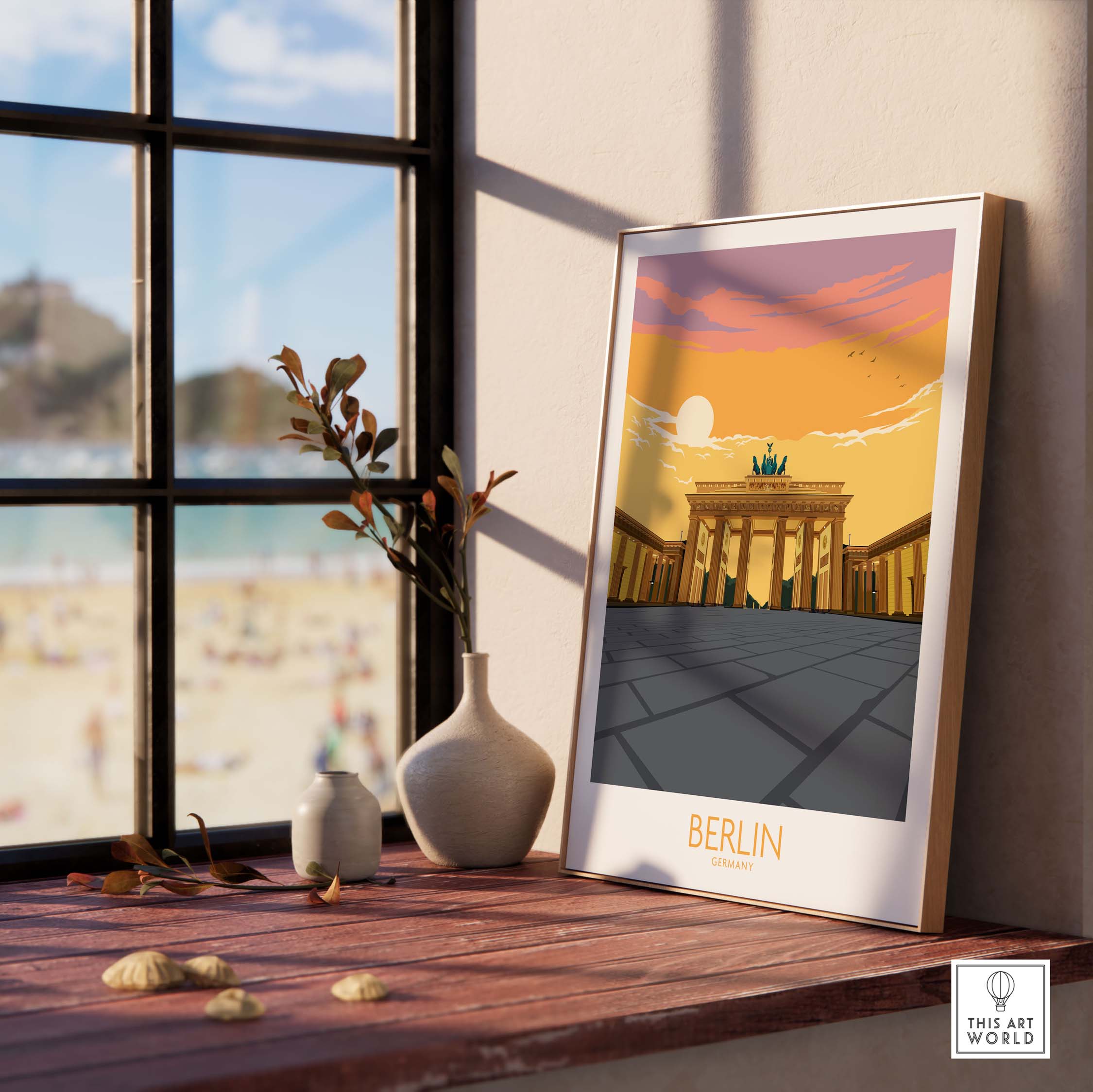 Berlin Print Germany Travel Poster displayed by a window, featuring the iconic Brandenburg Gate at sunset.