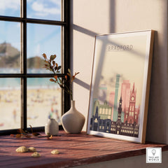 Bradford Print City Skyline Poster displayed in a bright room, showcasing iconic buildings in warm pastel tones.
