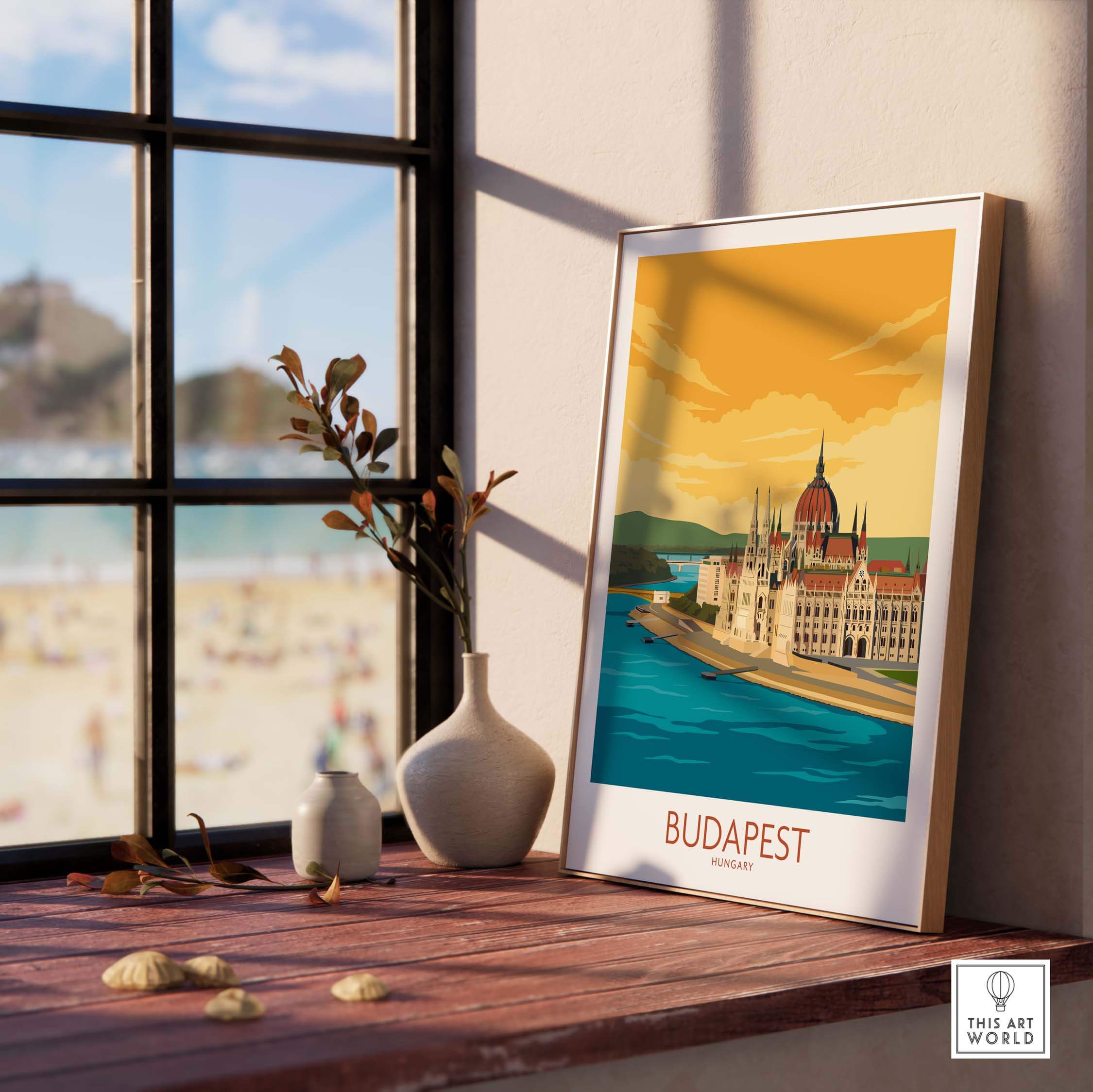 Budapest poster artwork displayed by a window, showcasing the iconic skyline and vibrant colors, perfect for travel enthusiasts.