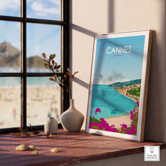 Framed Cannes Poster France Print displayed by a window, showcasing a coastal landscape in a minimalist style.