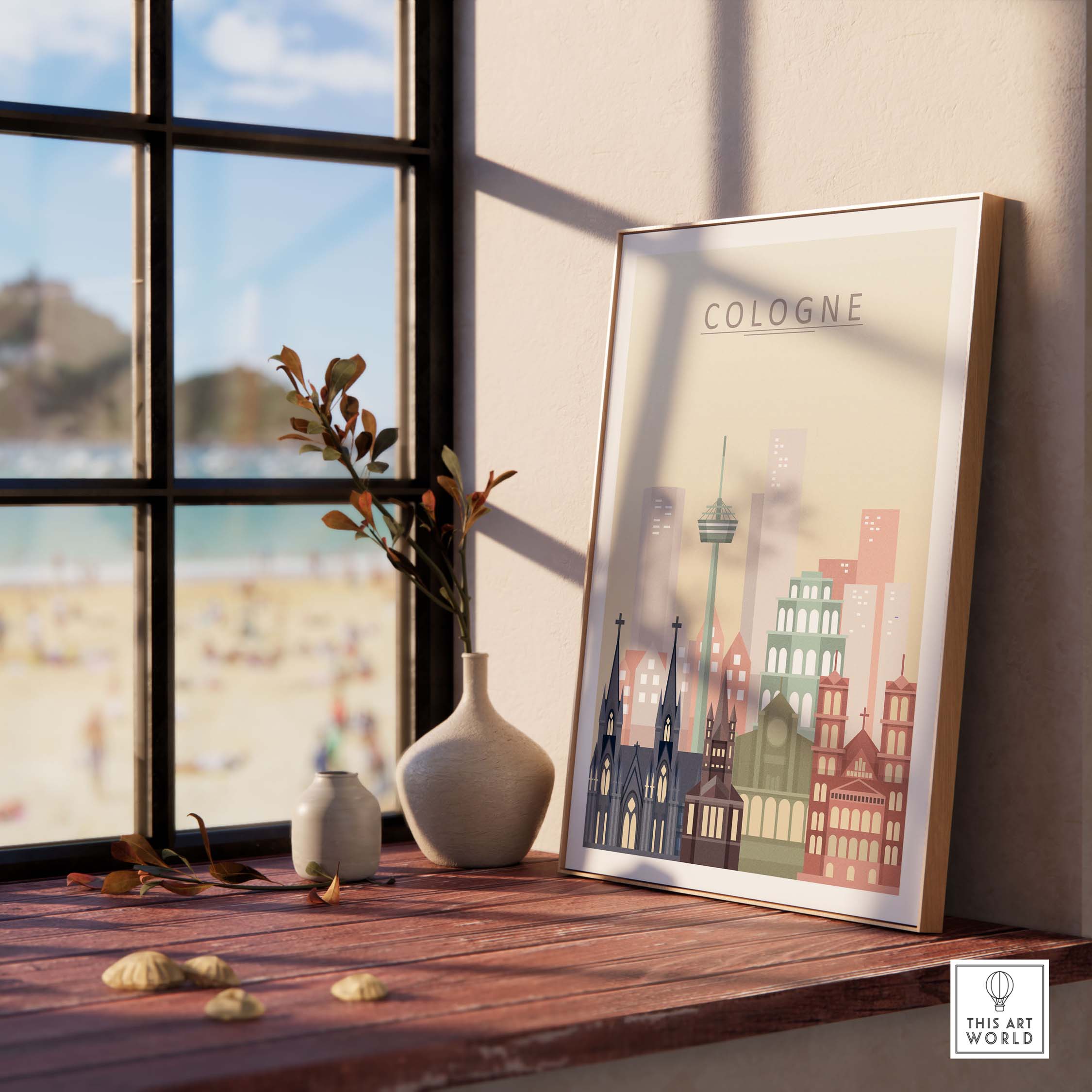 Cologne skyline print wall art with pastel colors, framed and displayed on a wooden table next to a window.
