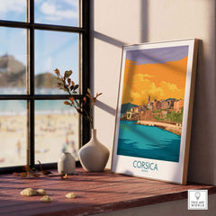 Corsica Poster France displayed on a wooden table with a beach view, showcasing vibrant colors and travel-inspired design.