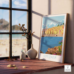 Cote d'Azur print poster displayed indoors by a window, capturing vintage travel art vibes and modern decor.