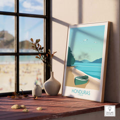 Honduras Poster Caribbean Print framed on a windowsill with a beach view, perfect for travel-inspired wall art.