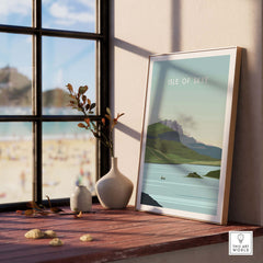 Isle of Skye Poster Print displayed on a windowsill, showcasing a serene landscape and vintage travel art design.