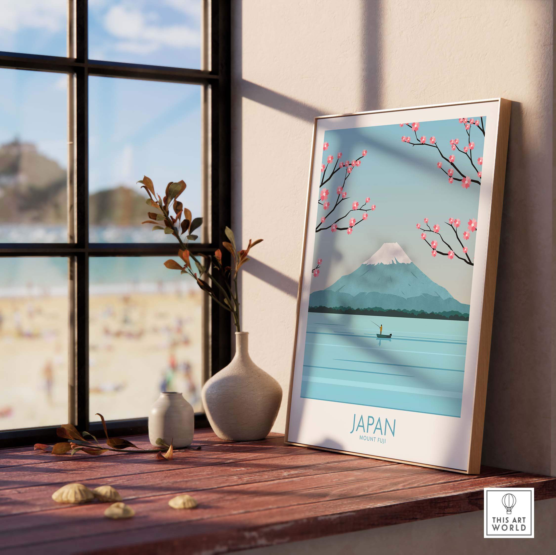Japan Print Mount Fuji Poster with cherry blossoms, framed on a windowsill, showcasing tranquil travel art.