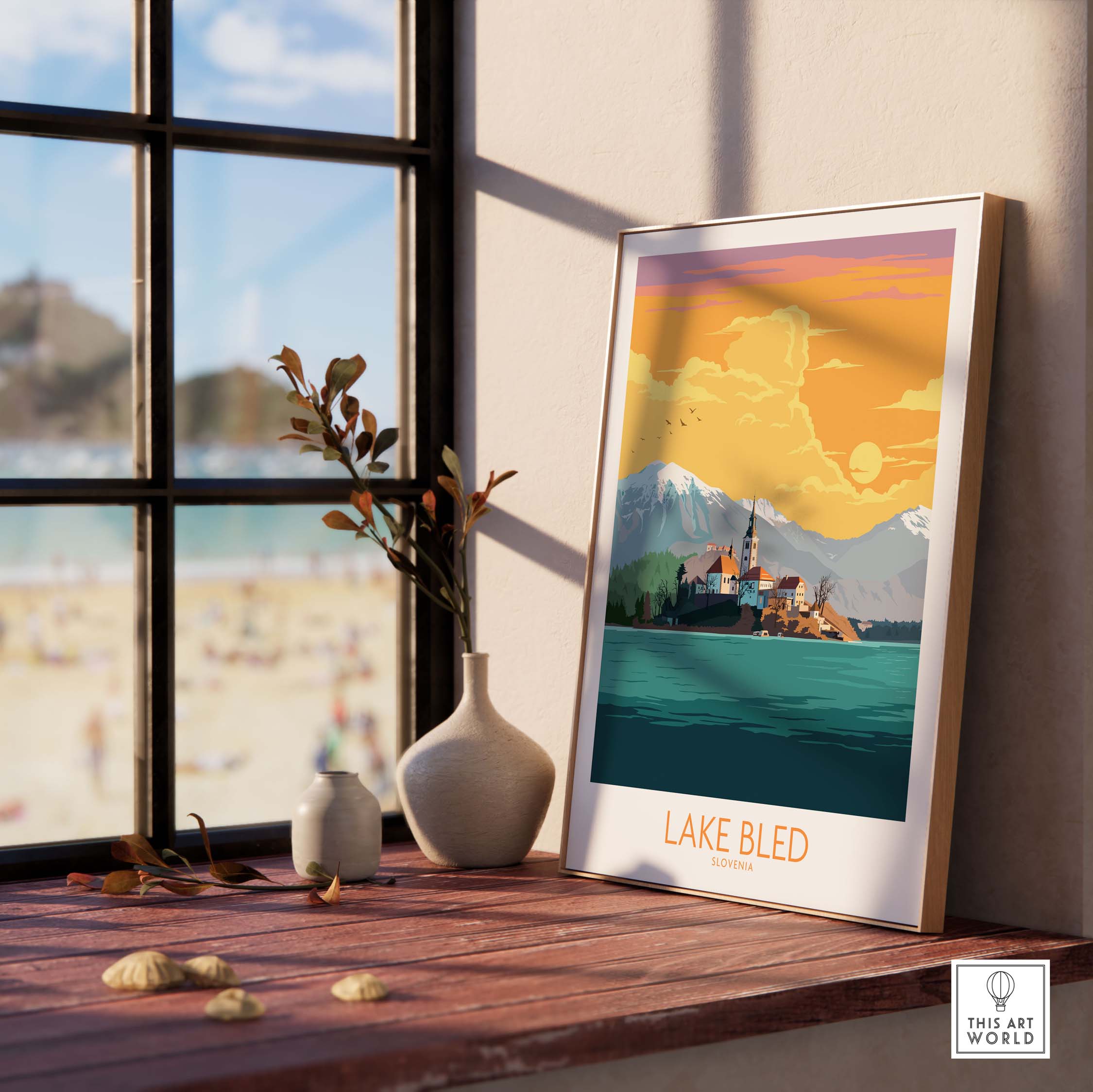 Lake Bled poster displayed indoors, featuring scenic landscape of Slovenia with sunset colors.
