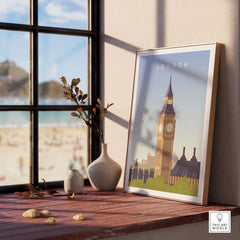 London Print Wall Art Poster featuring Big Ben, displayed on a wooden table by the window, highlighting vintage travel aesthetics.