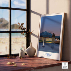 Lucerne Switzerland poster framed on a windowsill, showcasing vintage travel art and scenic views.