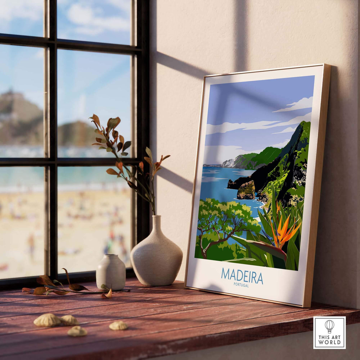 Madeira Print poster displayed on a windowsill, showcasing a vibrant landscape of Portugal's coast and greenery.