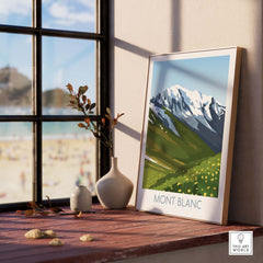 Mont Blanc print displayed in a bright room, showcasing a minimalist travel poster of snow-capped mountains and green hills.
