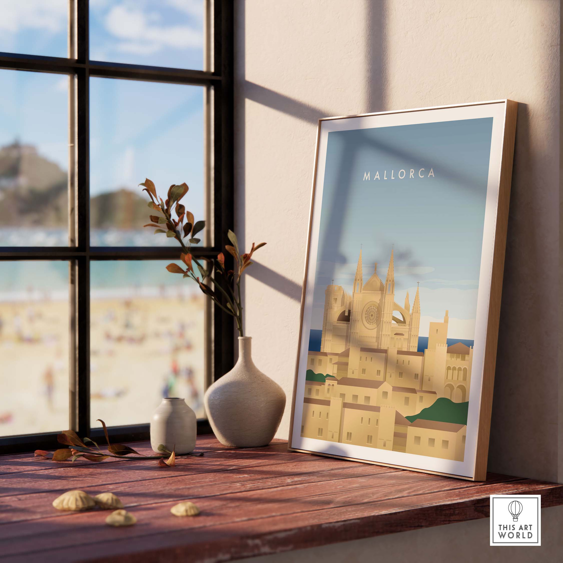 Framed Mallorca wall art poster on a wooden table with beach view, showcasing vintage-inspired travel design.