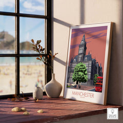 Stylish Manchester art print displayed on a table with a view of the beach, perfect for home decor.