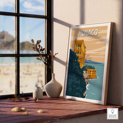 Monaco Wall Art Print featuring a scenic coastal view, framed and displayed on a sunny windowsill.