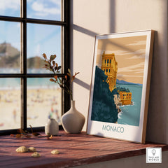 Monaco poster print displayed on a wooden table near a window, showcasing minimalist vintage travel art.