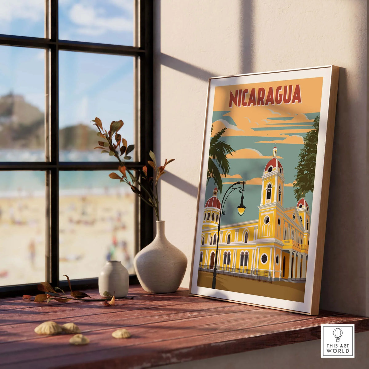 Nicaragua poster displayed by a window, showcasing vintage travel art and coastal scenery.