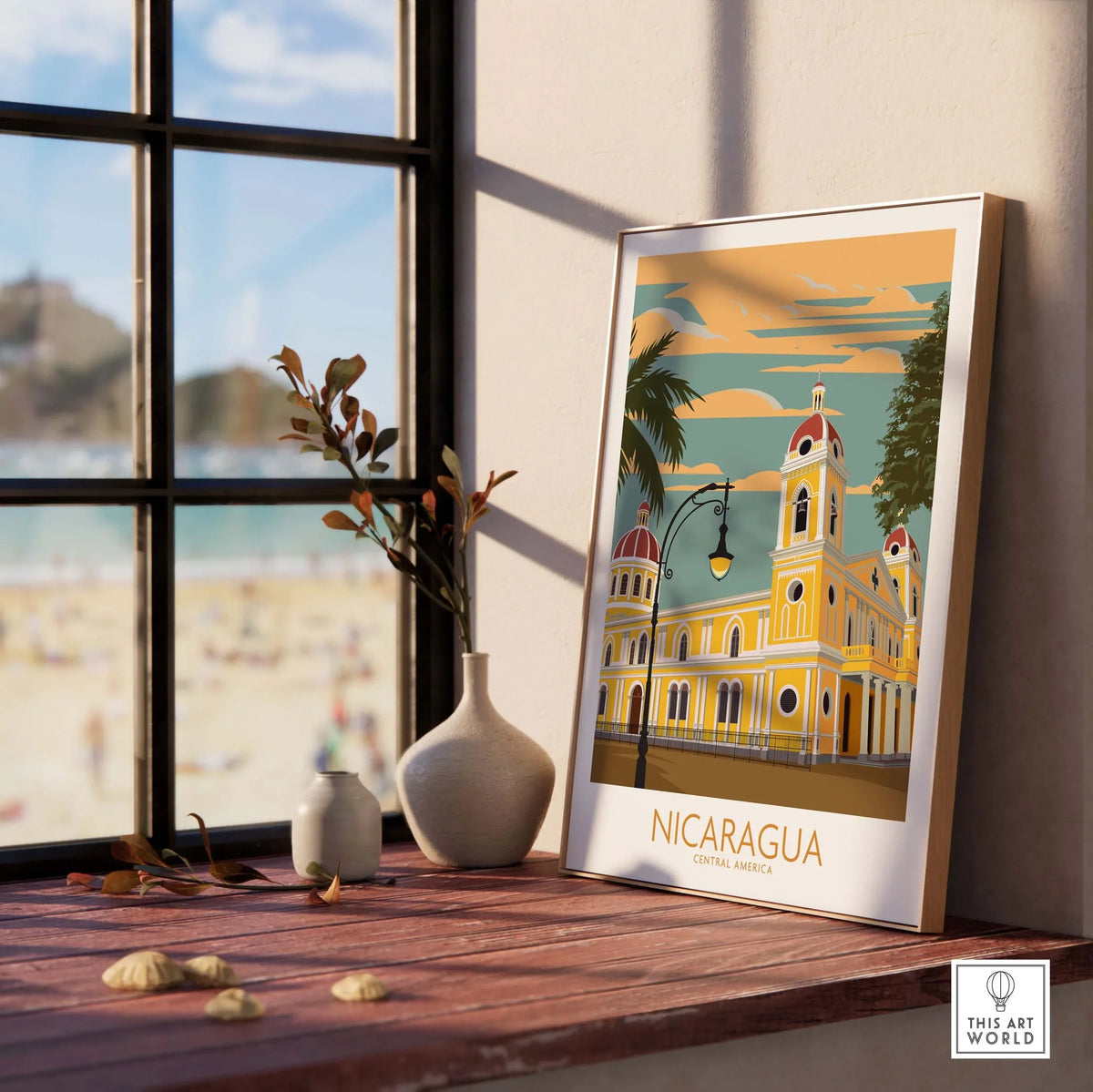 Nicaragua Print framed on a table with a beach view, showcasing vintage travel poster art for home decor.
