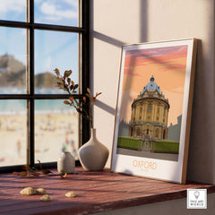 Oxford Travel Poster featuring vintage design, placed on a wooden table with natural lighting and decorative elements.