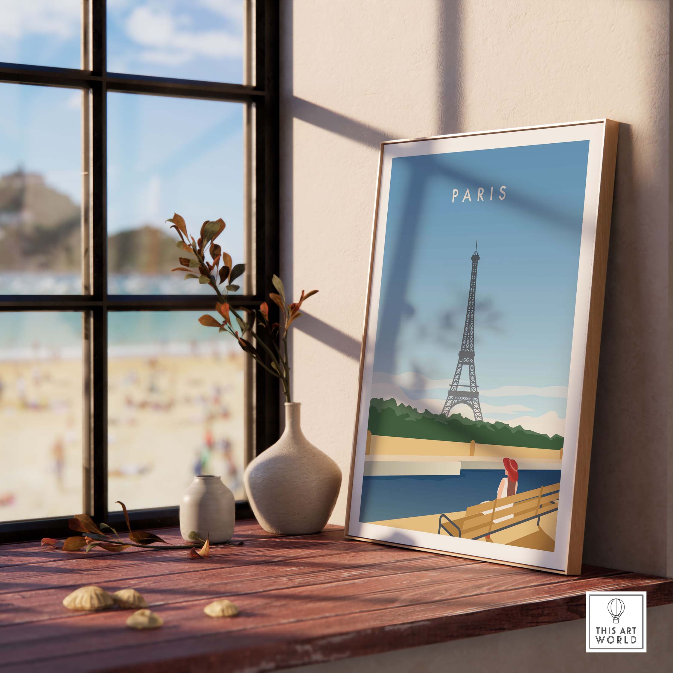 Paris Wall Art Poster featuring the Eiffel Tower, framed on a windowsill with beach view, adding travel inspiration to any space.